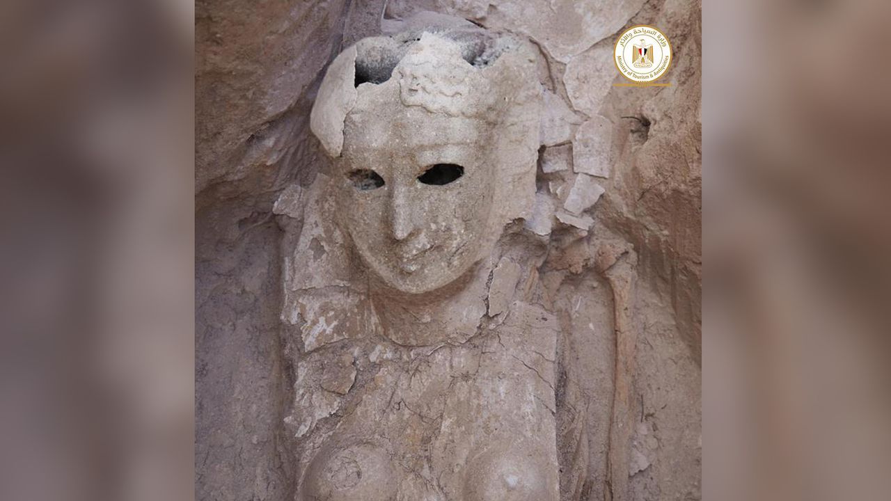 Among the other burials at the site, archaeologists discovered this female mummy who has a death mask that covers much of her body.
