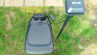 Top down view of Segway Navimow charging station and GPS antenna