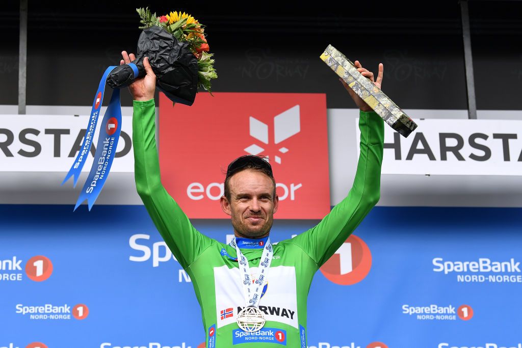 HARSTAD NORWAY AUGUST 08 Alexander Kristoff of Norway and Team Norway Green Points Jersey celebrates at podium during the 8th Arctic Race Of Norway 2021 Stage 4 a 1635km stage from Gratangen to Harstad 54m ArcticRace on August 08 2021 in Harstad Norway Photo by Stuart FranklinGetty Images
