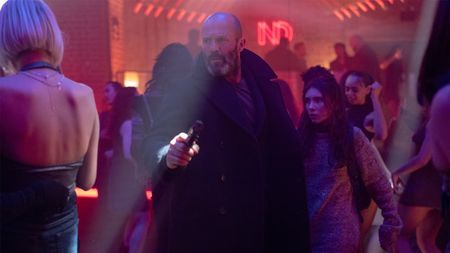 Jason Statham in a club with a gun Shelter