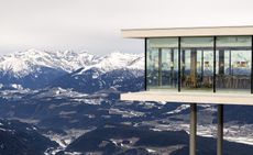 Exterior view of AlpiNN restaurant and the mountain views in Italy