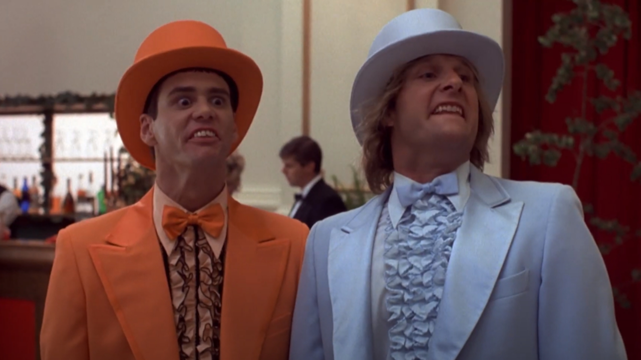 Jim Carrey and Jeff Daniels make ridiculous faces in loud tuxedos in Dumb and Dumber.