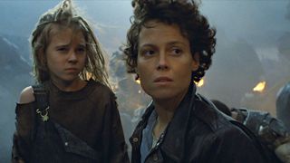 Sigourney Weaver as Ellen Ripley and Carrie Henn as Rebecca during the sci-fi movie, Aliens.