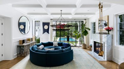 Margot Robbie’s living room with a rope swing, plants and fireplace 