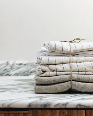 Folded bed linens tied together