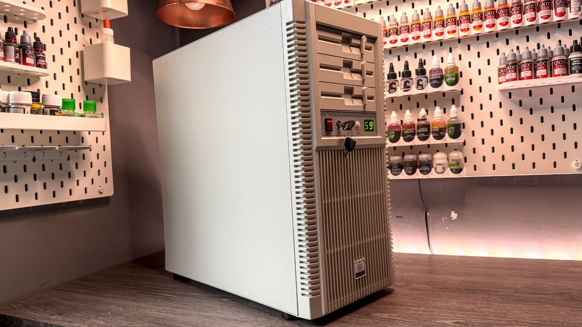The retro-styled Silverstone FLP02 PC case as a PC is being built into it on a desk.