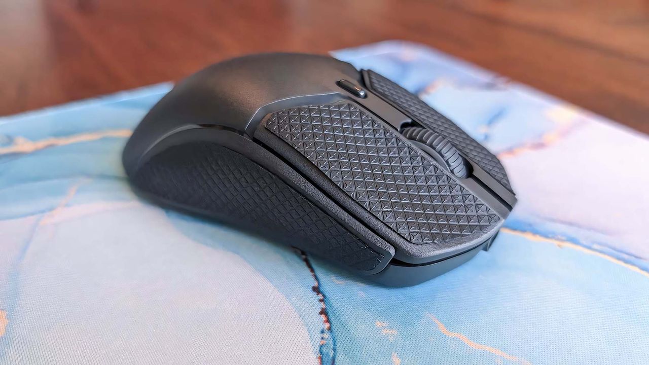 HyperX Pulsefire Haste 2 Mini Wireless with grips attached.