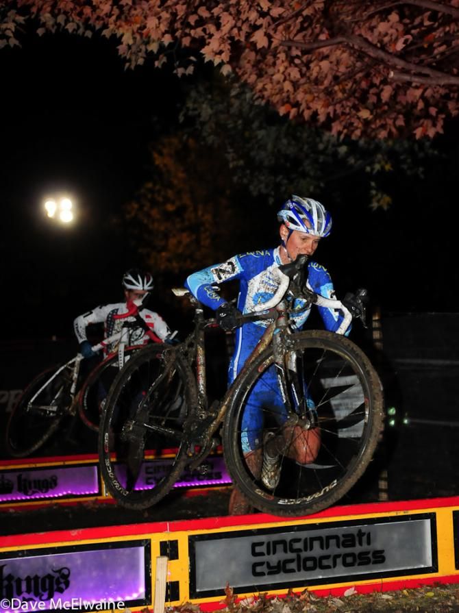 Katerina Nash (Luna Pro Team) running the lighted barriers with Compton in tow