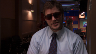 Chris Pratt as Burt Macklin in Parks and Recreation