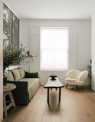 Plank wood flooring in a white living room