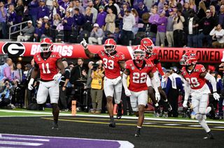 Georgia players celebrate an interception during the 2023 national championship game. 
