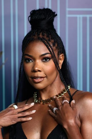 Gabrielle Union wears her hair in braids and in a half-up half-down style whilst attending as Tiffany & Co. Celebrates the reopening of NYC Flagship store, The Landmark on April 27, 2023 in New York City.