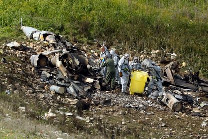 A picture taken in the northern Israeli Kibbutz of Harduf on February 10, 2018, shows the remains of an Israel F-16 that crashed after coming under fire by Syrian air defences during attacks 