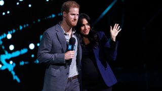 Prince Harry, Duke of Sussex and Meghan, Duchess of Sussex speak on stage during WE Day UK 2019 at The SSE Arena on March 06, 2019 in London, England. (Photo by John Phillips/Getty Images)