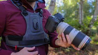 Cotton Carrier G3 worn by a man in a burgandy jacket outdoors in a woods