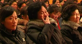 North Korean workers react to Kim Jong-Il's death.