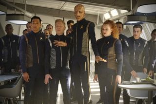 The crew of the Discovery, including (left to right) Patrick Kwok-Choon as Rhys, Anthony Rapp as Stamets, Doug Jones as Saru, and Mary Wiseman as Tilly in the episode "If Memory Serves."