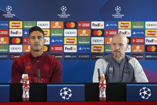 Head coach Erik ten Hag (R) and Raphael Varane (L) of Manchester United attend a press conference ahead of UEFA Champions League week 2 football match between Galatasaray and Manchester United on October 2, 2023 in Manchester, United Kingdom. (Photo by Rasid Necati Aslim/Anadolu Agency via Getty Images)