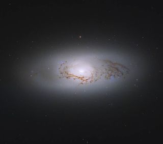 a glowing white ring of material in deep space