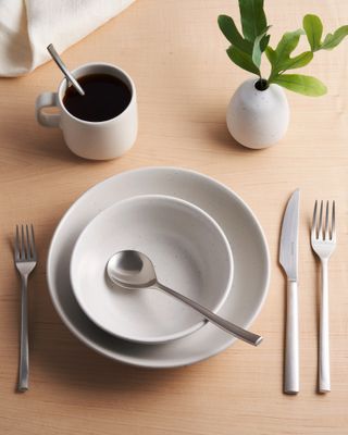 Monoware cutlery set on table with tableware