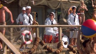 The Wonders dressed as Capt Geech and the Shrimp Shack Shooters on the set of Weekend at Party Pier in That Thing You Do!