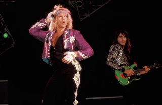 David Lee Roth (front, left) and Steve Vai perform onstage