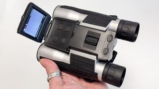 Camonity 12x32 Digital Binoculars with Camera being held in someone's hand