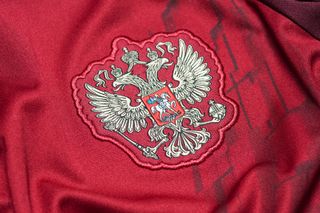 The Russia national football team crest on a red shirt