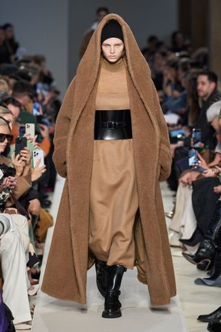 Woman in hooded terry coat on Max Mara runway