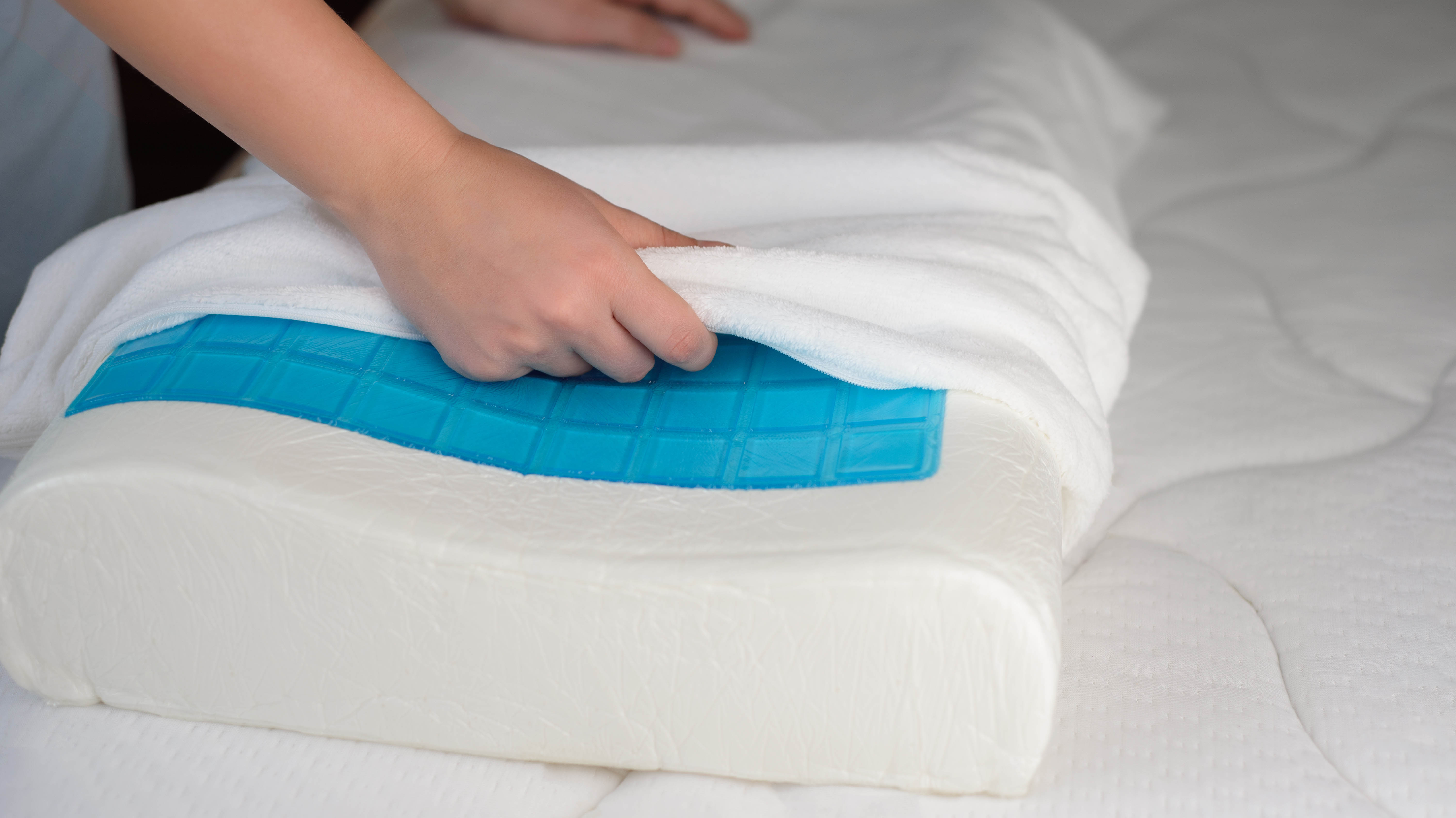 A pillow protector being fitted on an orthopedic pillow