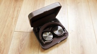 the beoplay h95 headphones in their case