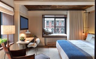 Bedroom view with side table and window seat