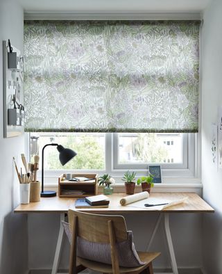 craft room with a roller blind