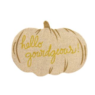 A white pumpkin door mat that says 'hello gourdgeous'
