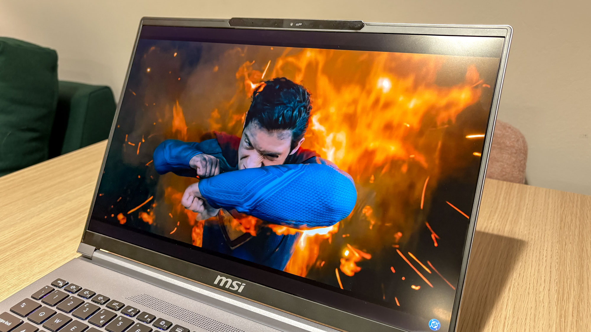 MSI Creator A16 AI+ display showing Superman trailer with fire around him