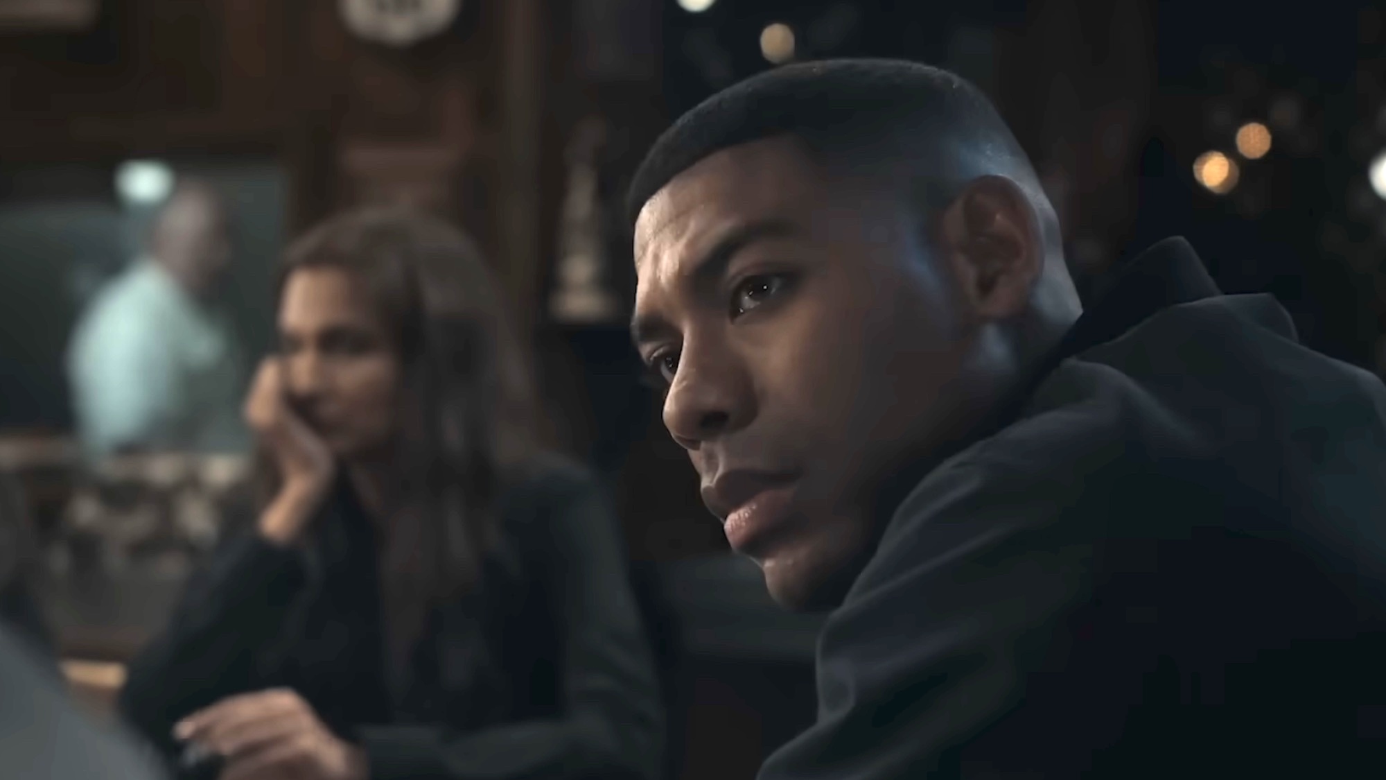 John Stewart in a bar in the Lanterns trailer
