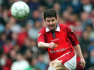 Denis Irwin playing for Manchester United in 1997