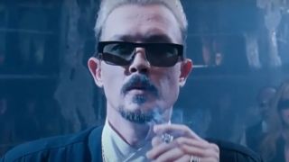 Robert Patrick smoking a cigarette and wearing sunglasses in Double Dragon