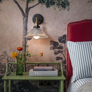 red headboard with striped bedding