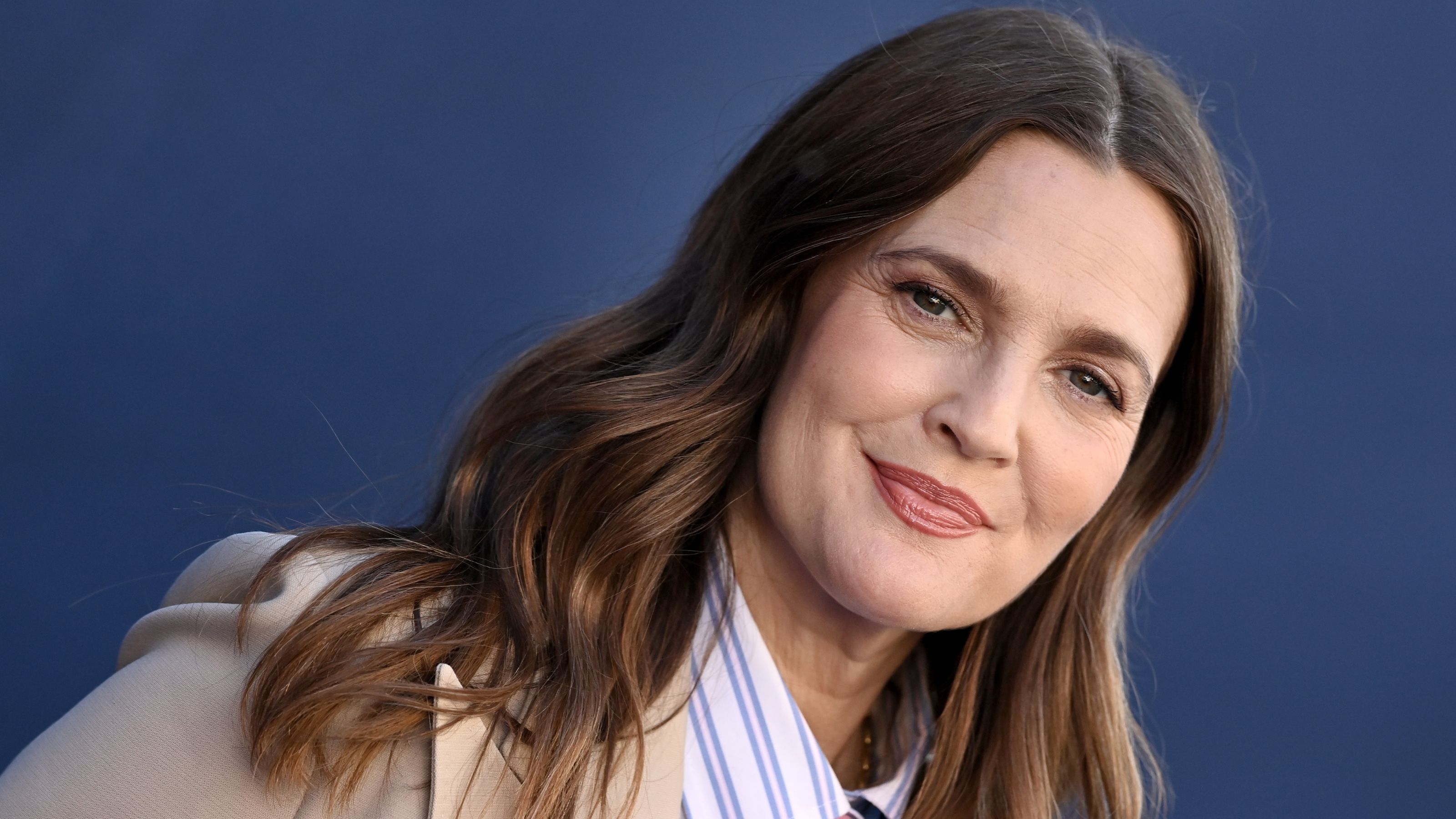 drew barrymore ona blue background