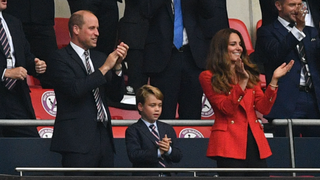 Prince William, Duke of Cambridge, Prince George of Cambridge, and Catherine, Duchess of Cambridge, celebrate the first goal in the UEFA EURO 2020 round of 16 football match between England and Germany at Wembley Stadium in London on June 29, 2021