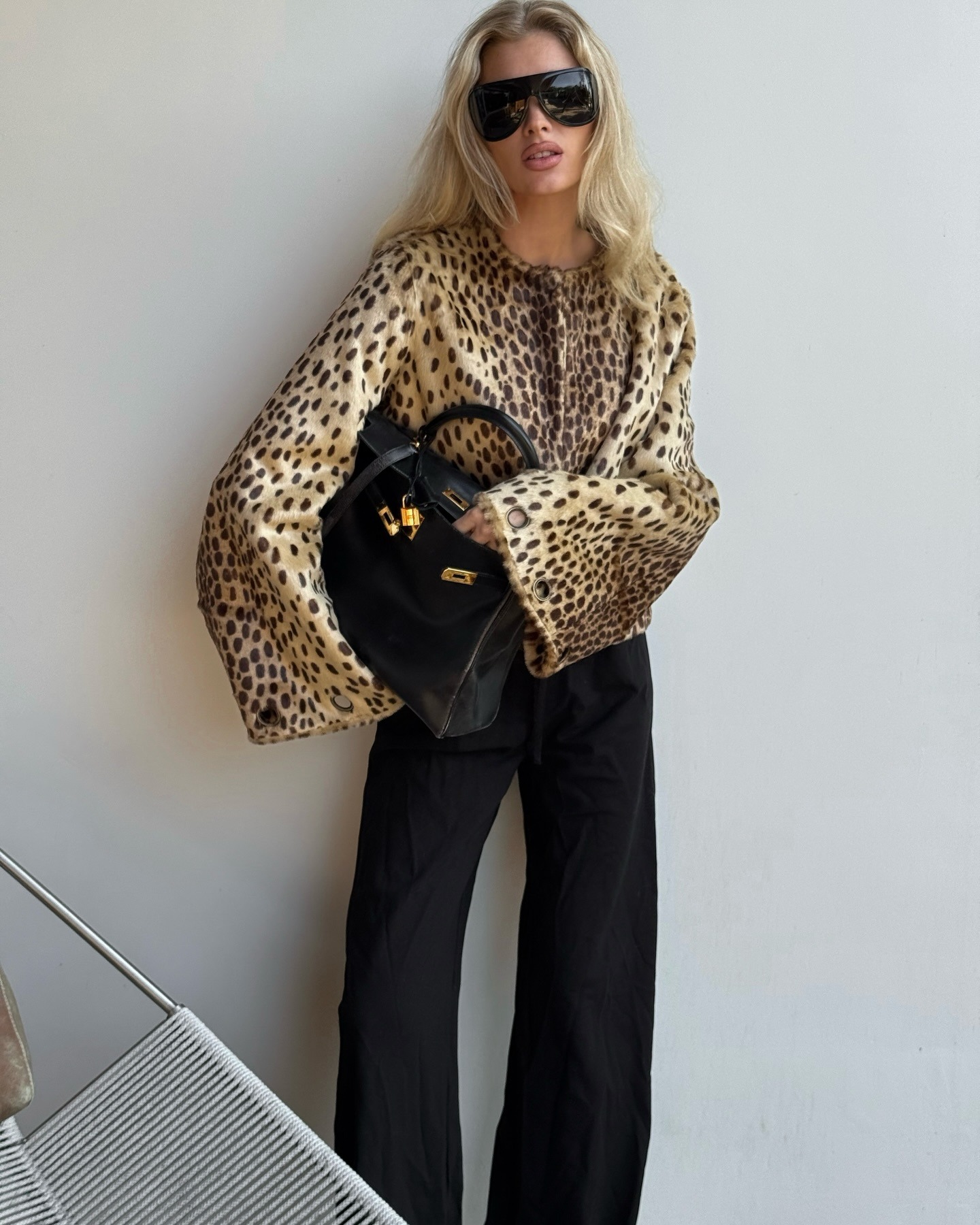 Elsa Hosk in a leopard print jacket and black pants