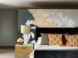 Bedroom with mural headboard and side table