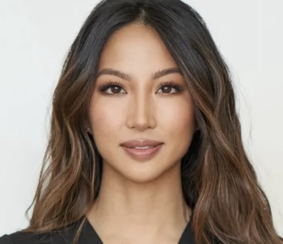 an asian woman with long dark hair facing the camera