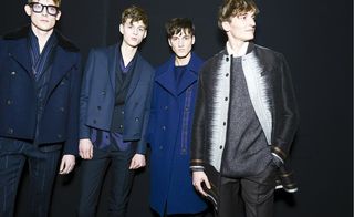Four male model posing in clothes