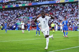 Bukayo Saka of England celebrates scoring a goal which is disallowed during the UEFA EURO 2024 group stage match between England and Slovenia at Cologne Stadium on June 25, 2024 in Cologne, Germany. (Photo by Robbie Jay Barratt - AMA/Getty Images)