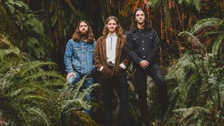 Ever Age standing amongst vegetation