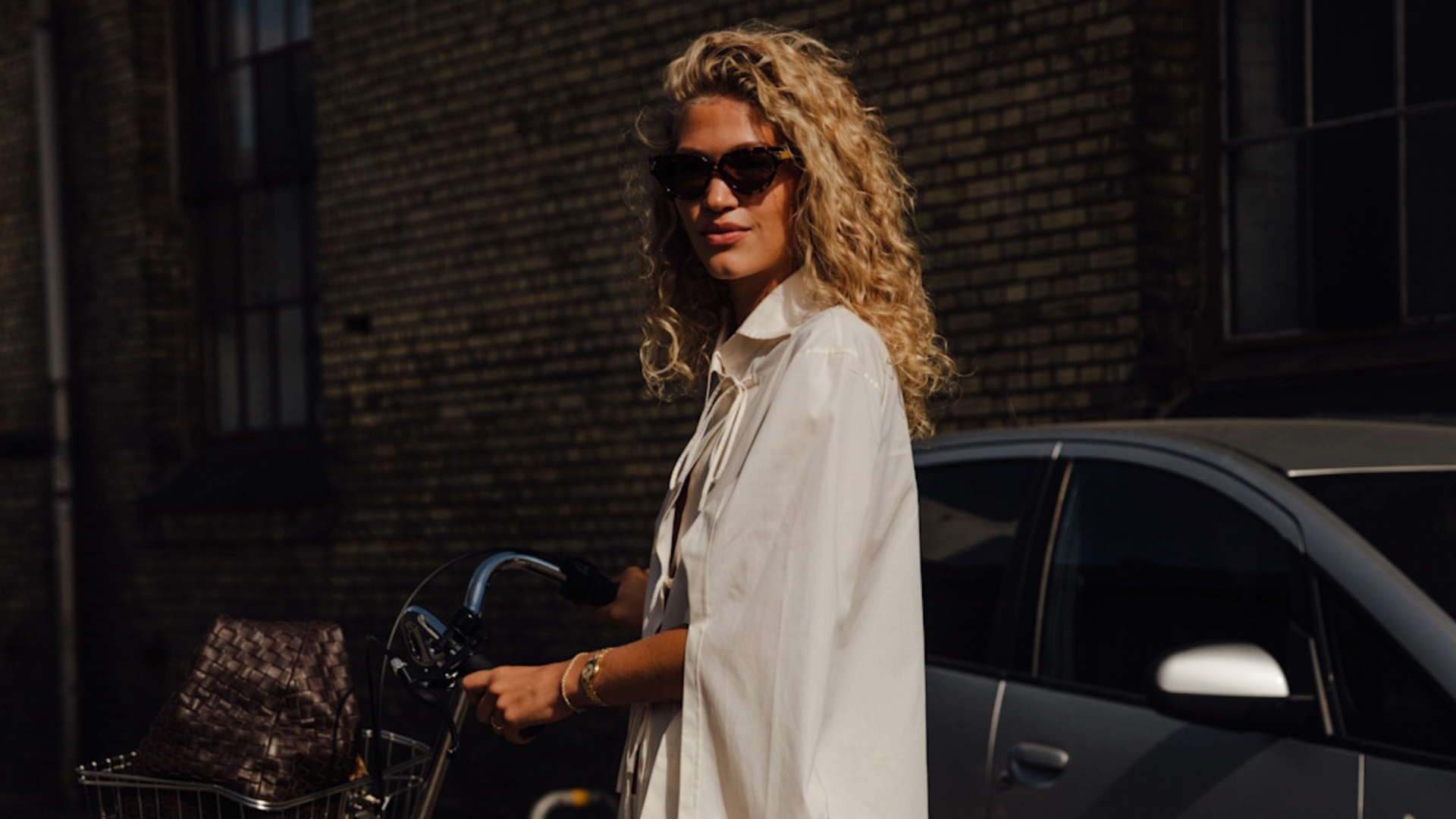 woman wearing an all-white outfit in copenahgen