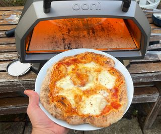 A finished cheese pizza baked in the Ooni Karu 2 Pro