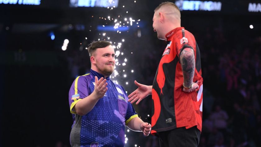 Luke Littler, wearing purple shirt, is congratulated by Nathan Aspinall during the BetMGM Premier League Darts on April 04, 2024 in Manchester, England, in the build up to tonight&#039;s PDC World Darts Championship quarter-final 2025